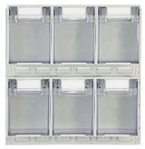 Clear plastic containers mounted to metal backing board