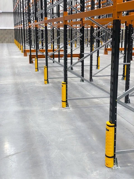 Warehouse racking with impact protection on uprights