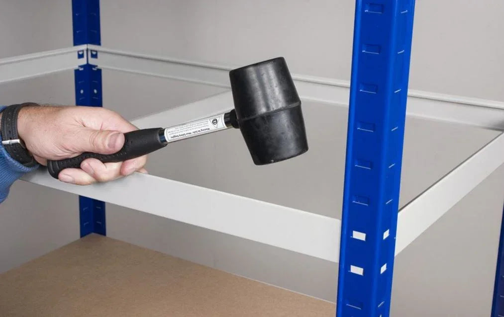 Rubber mallet used to secure steel beam connections during assembly